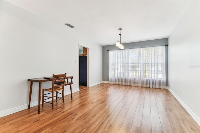 dining area featuring light wood-type flooring