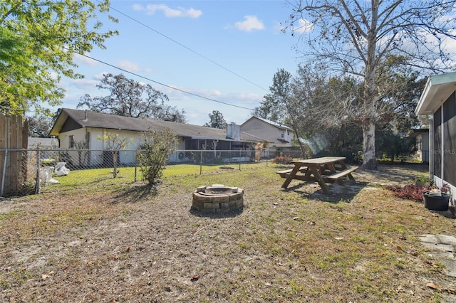 view of yard with an outdoor fire pit