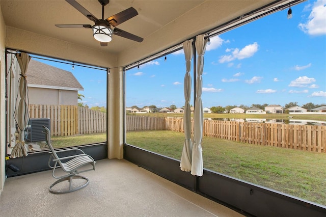 sunroom / solarium with ceiling fan