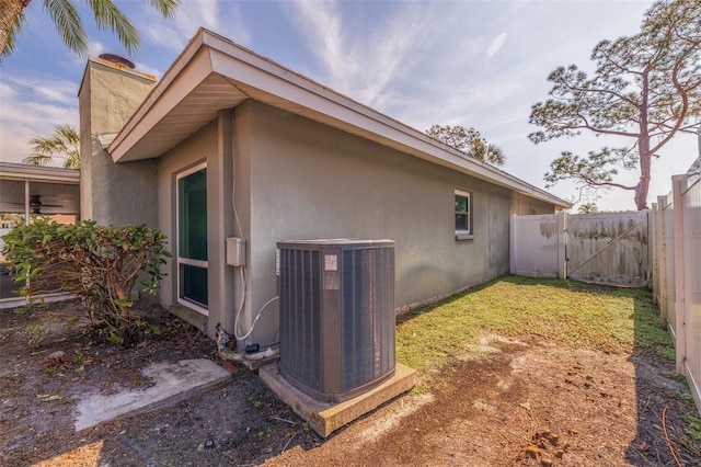 view of side of property featuring central AC unit