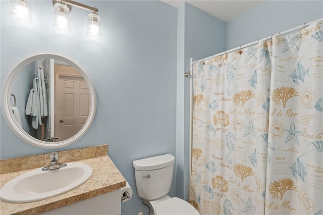 bathroom featuring vanity, a shower with curtain, and toilet