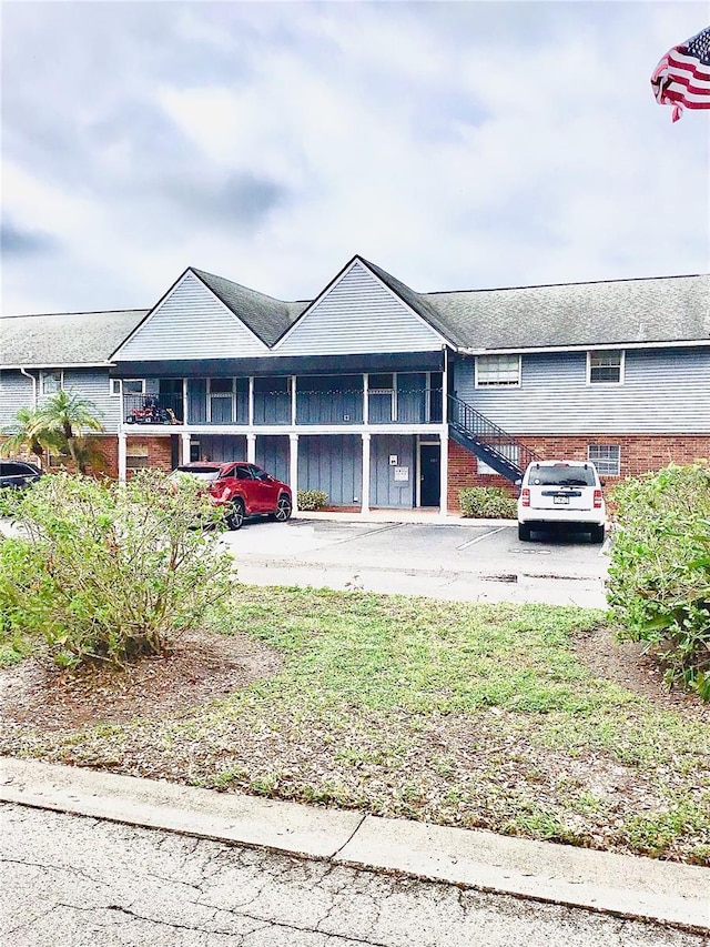 200 Country Club Dr Unit 407, Largo, FL 33771 - view of front of property featuring stairway