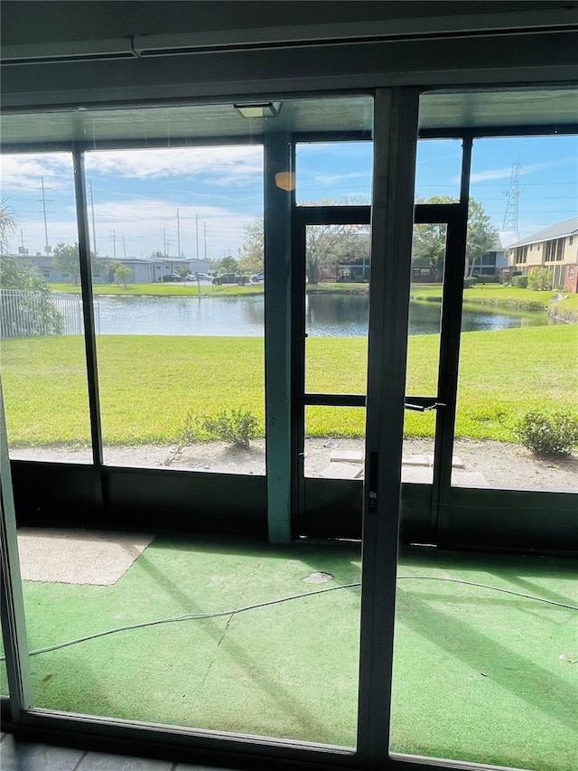 entryway featuring a water view