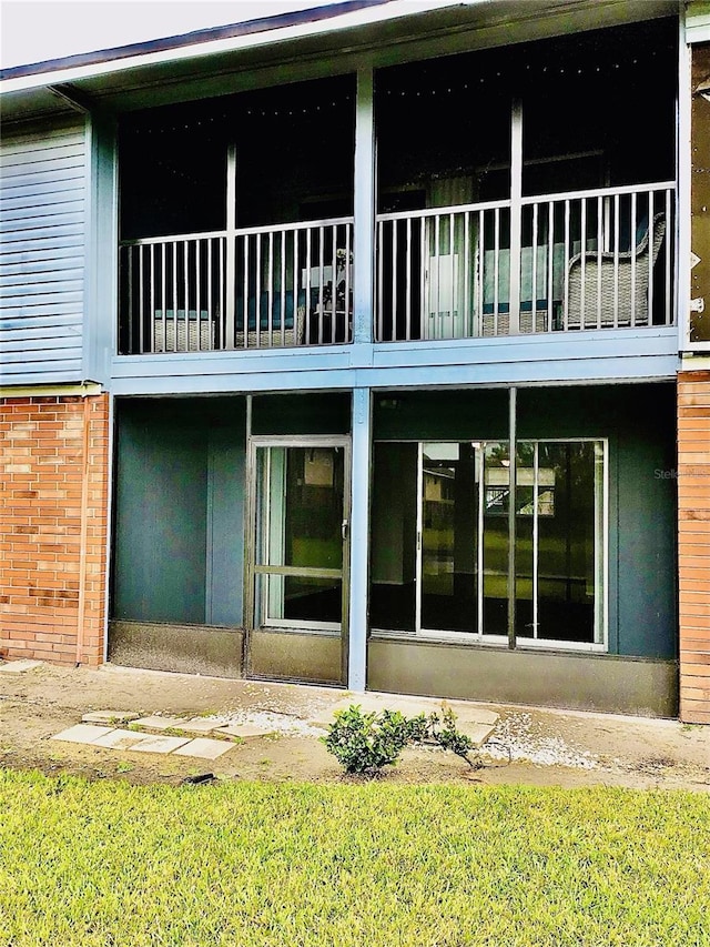 rear view of house featuring a balcony