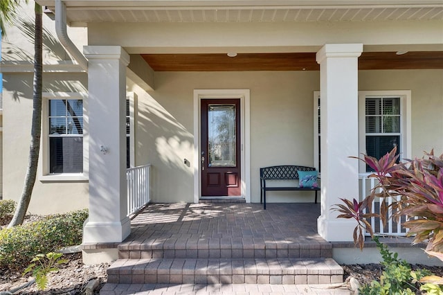 property entrance featuring a porch