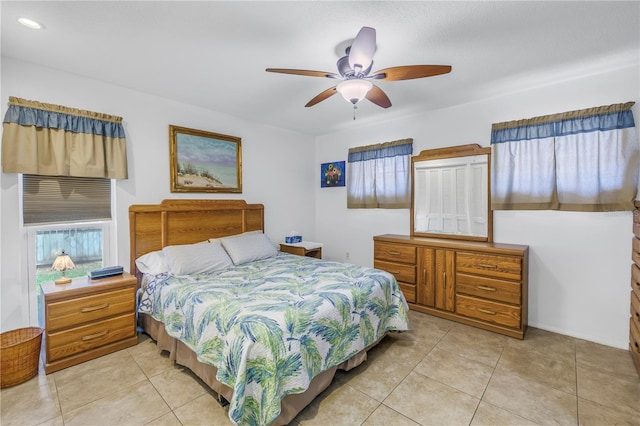 bedroom with light tile patterned floors and ceiling fan