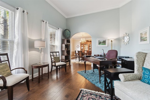 home office with crown molding, dark hardwood / wood-style floors, a chandelier, and a high ceiling