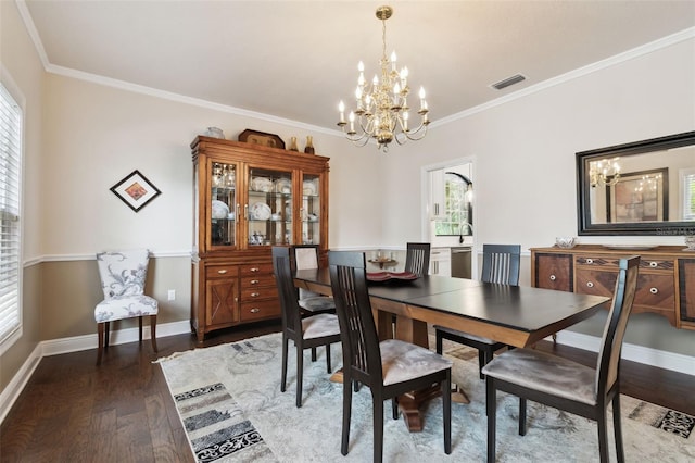 dining area with crown molding, dark hardwood / wood-style flooring, and a notable chandelier