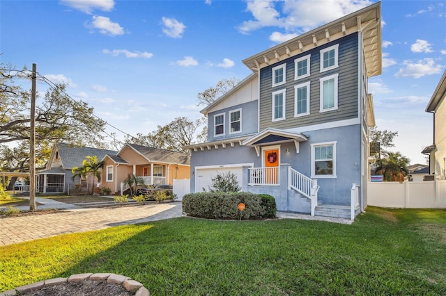 view of front of house with a garage and a front yard