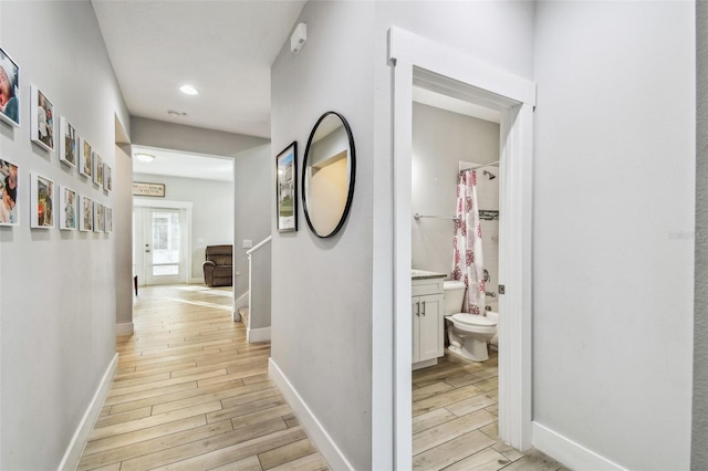 hallway featuring light wood-type flooring