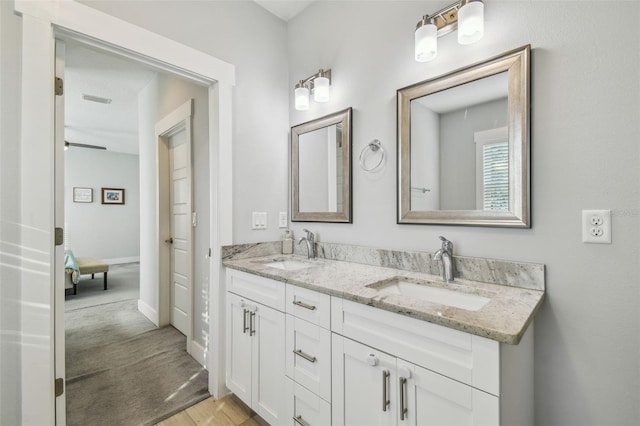 bathroom featuring vanity and hardwood / wood-style floors