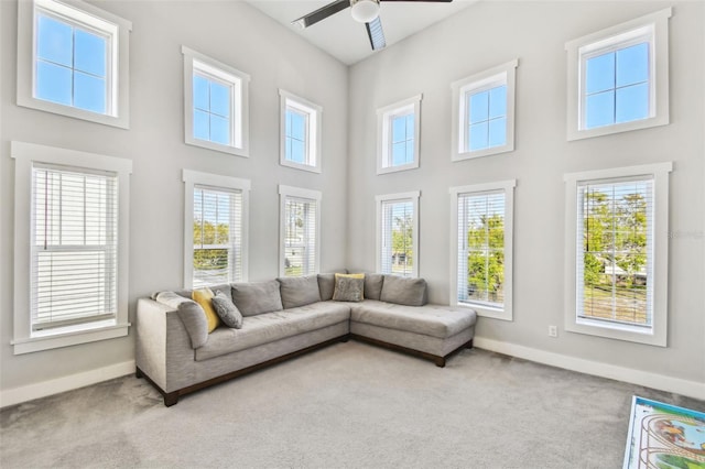 sunroom / solarium featuring ceiling fan