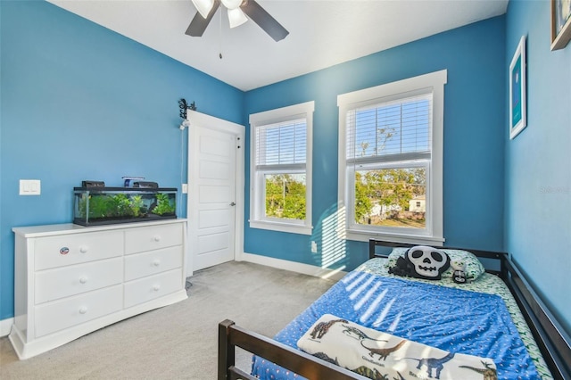 bedroom with light colored carpet and ceiling fan