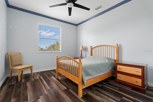 bedroom featuring ornamental molding, dark wood-type flooring, and ceiling fan