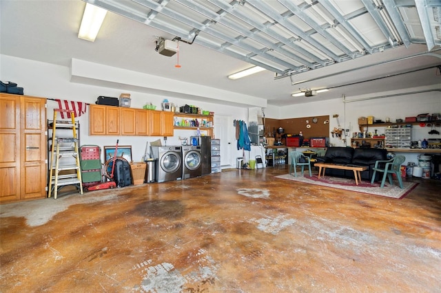 garage with a garage door opener, washing machine and dryer, and a workshop area