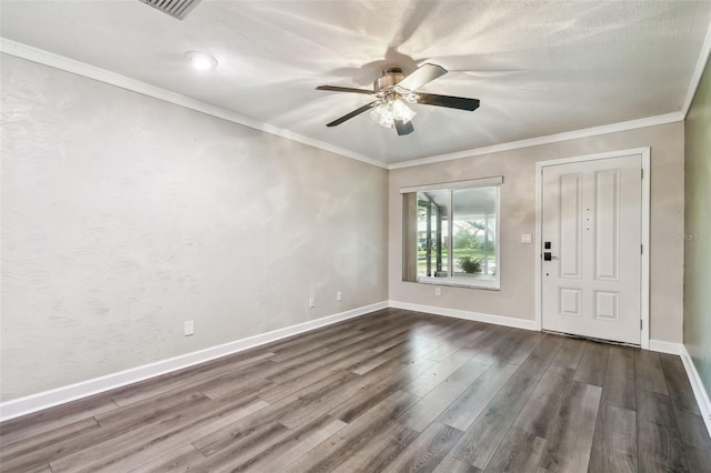 empty room featuring hardwood / wood-style flooring, ceiling fan, and ornamental molding