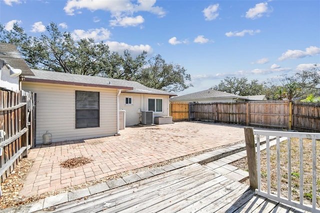 exterior space with a patio and central air condition unit