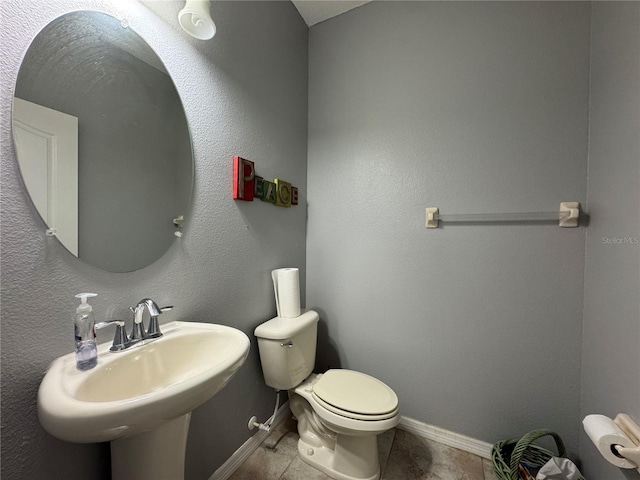 20314 Starfinder Way, Tampa, FL 33647 - bathroom with sink, toilet, and tile patterned flooring