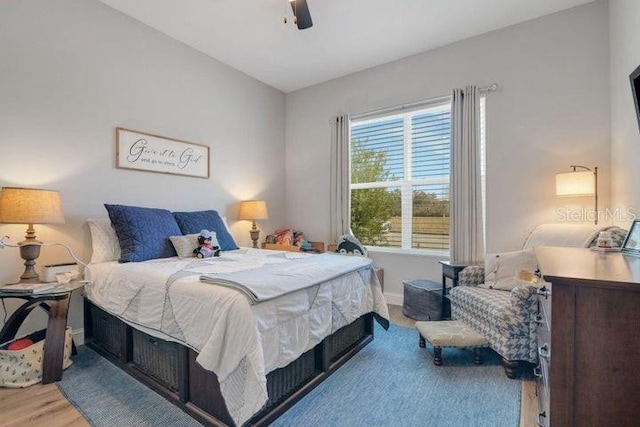 bedroom featuring ceiling fan and wood-type flooring