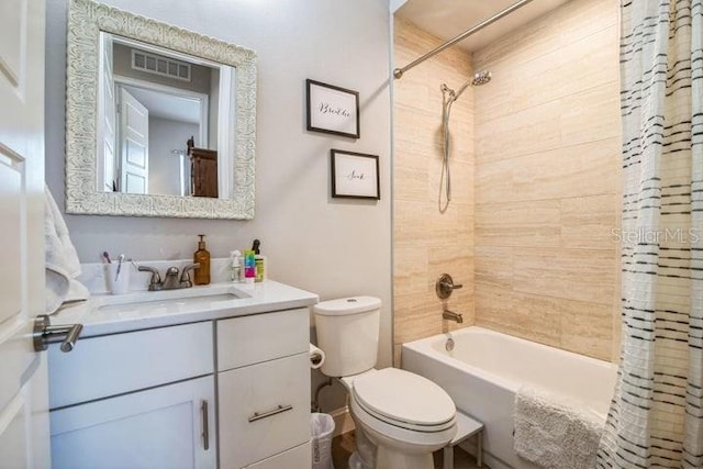 full bathroom featuring vanity, toilet, and shower / bath combo with shower curtain