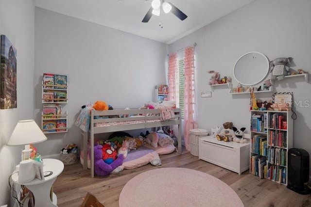 bedroom featuring ceiling fan and light wood-type flooring