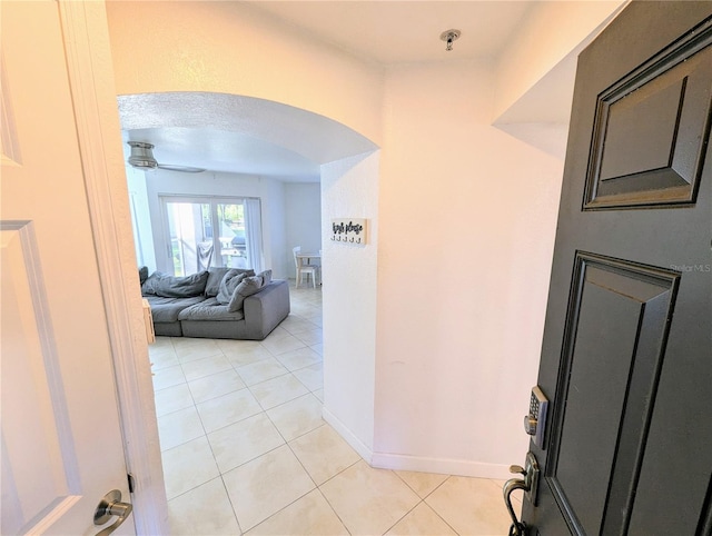 hallway with light tile patterned floors