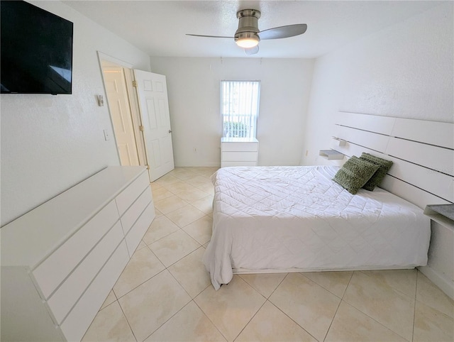 bedroom featuring light tile patterned floors and ceiling fan