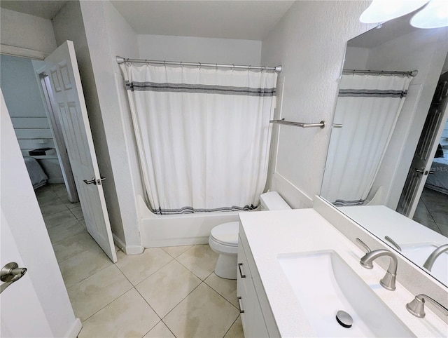 full bathroom featuring vanity, shower / bathtub combination with curtain, tile patterned floors, and toilet