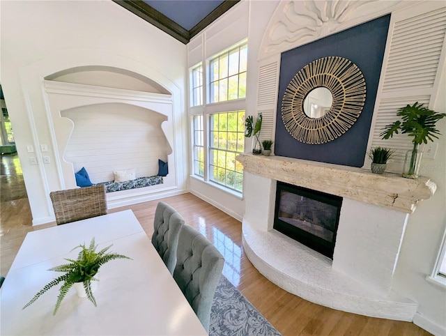 interior space featuring a high end fireplace and wood-type flooring