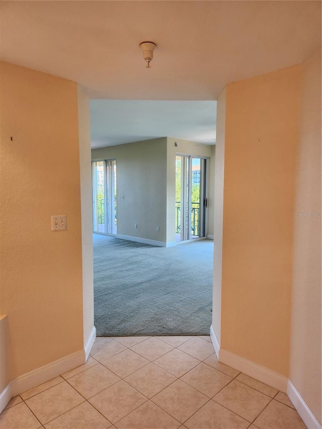 hallway with light carpet