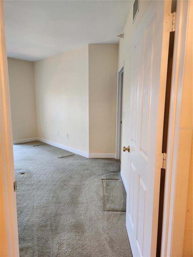 unfurnished room with carpet floors