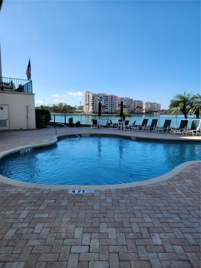 view of swimming pool featuring a patio area