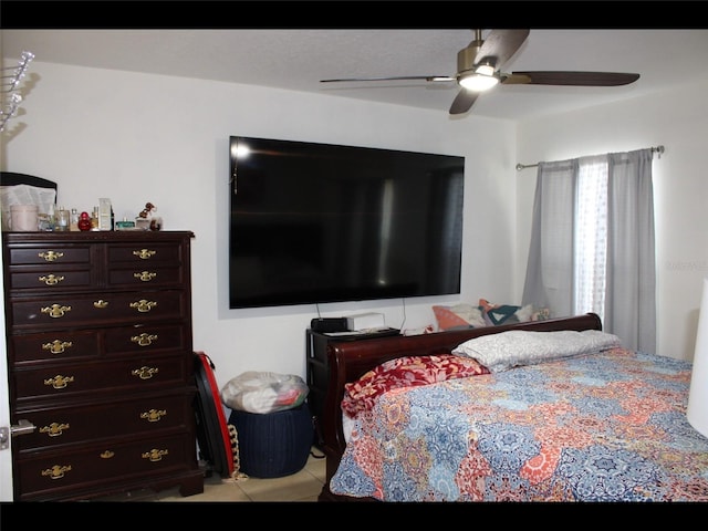 tiled bedroom with ceiling fan