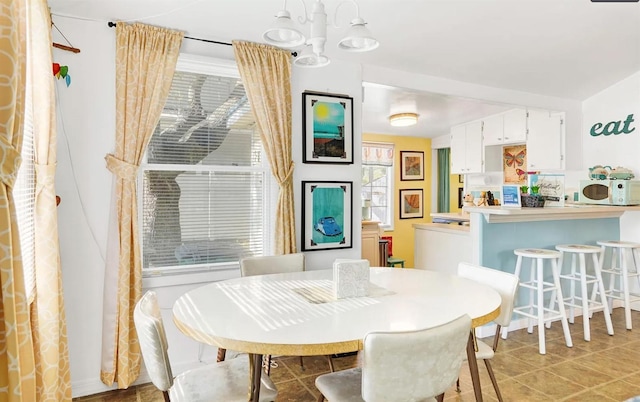 dining area featuring a chandelier