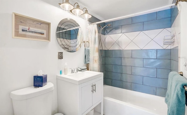 full bathroom with vanity, shower / bath combo, and toilet