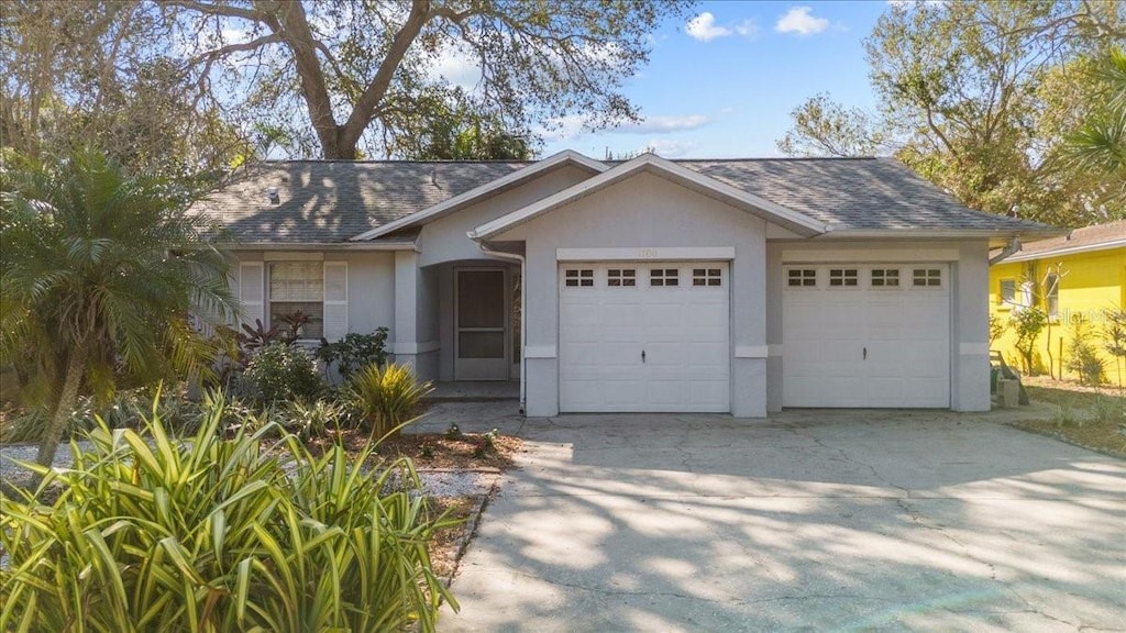 ranch-style house featuring a garage