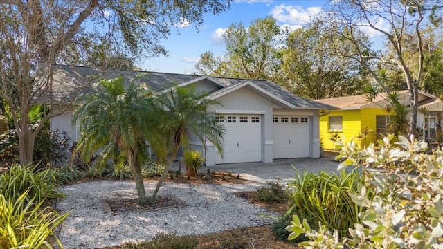 ranch-style house featuring a garage