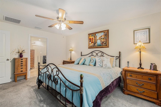 bedroom featuring connected bathroom, ceiling fan, and carpet flooring