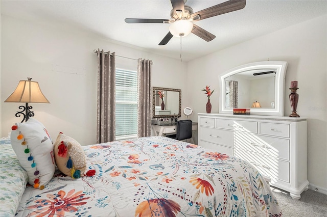 bedroom with ceiling fan and carpet flooring