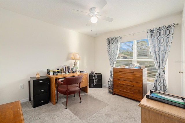 office area with ceiling fan and carpet