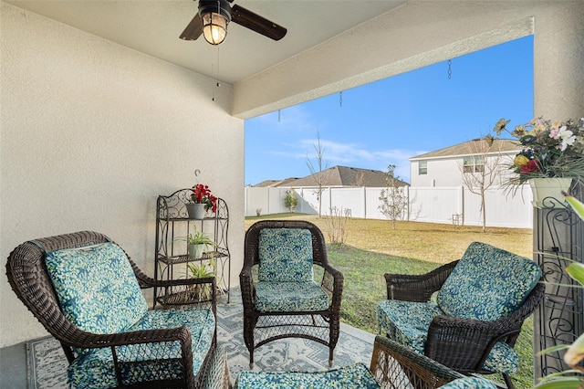 view of patio featuring ceiling fan