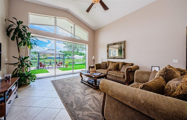 tiled living room with high vaulted ceiling and ceiling fan