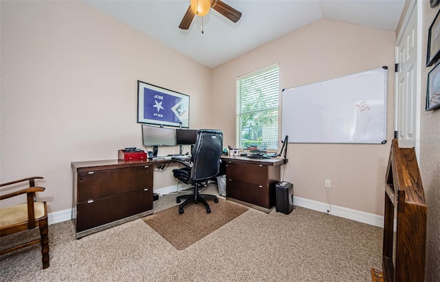 office space featuring vaulted ceiling, carpet, and ceiling fan