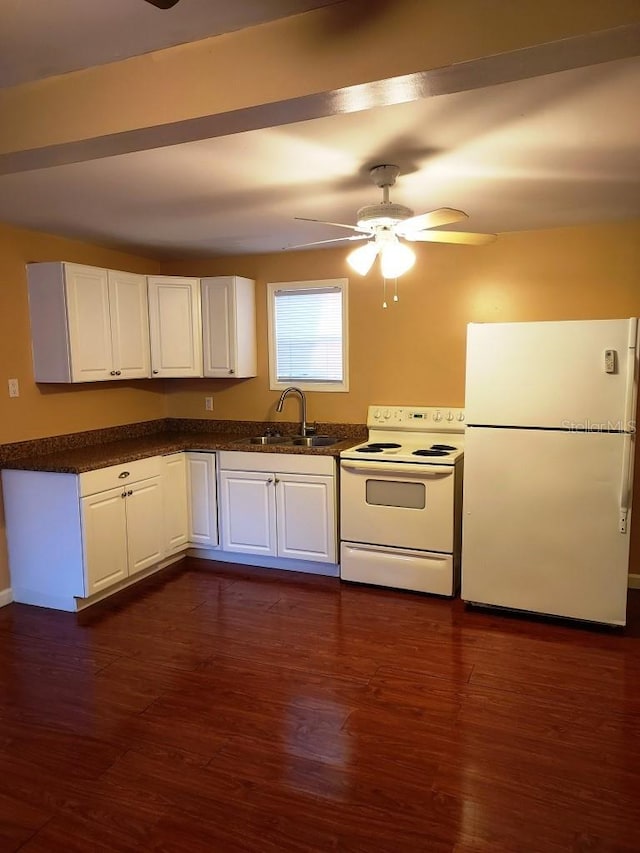 kitchen with sink, white appliances, dark wood-type flooring, ceiling fan, and white cabinetry