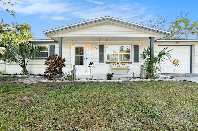 ranch-style house with a garage, a front yard, and covered porch