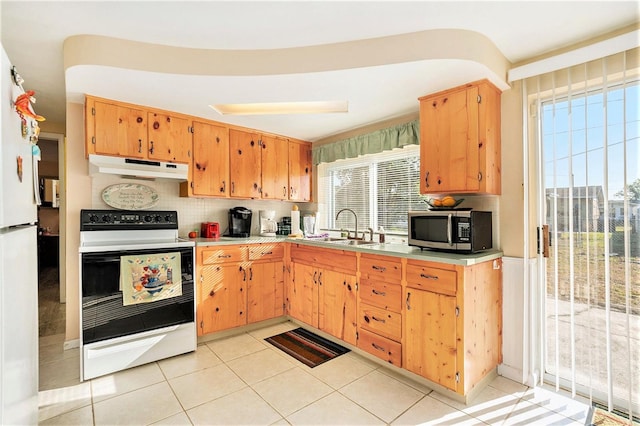 kitchen with tasteful backsplash, white electric range, sink, and light tile patterned floors