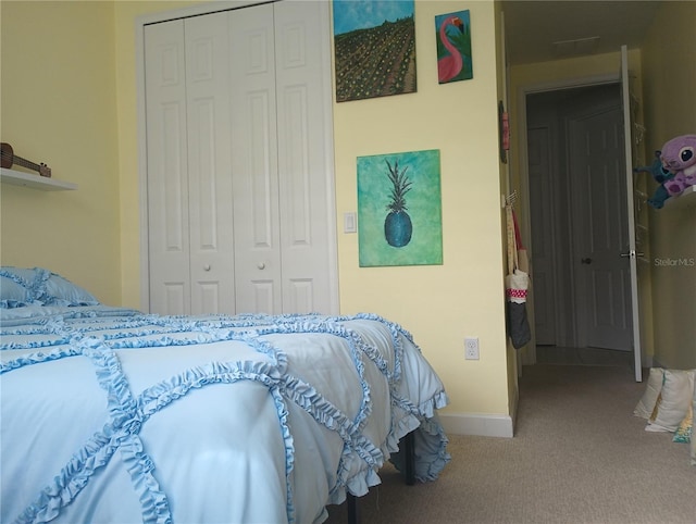 carpeted bedroom with a closet