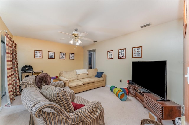 living room with light colored carpet and ceiling fan