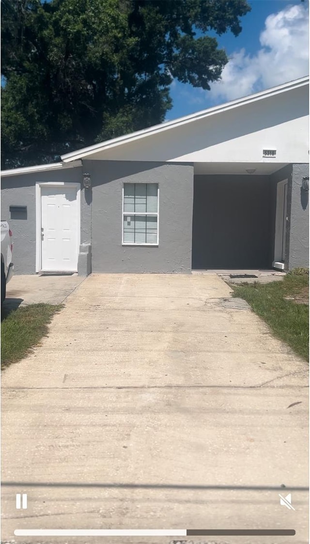 view of front of property with a carport