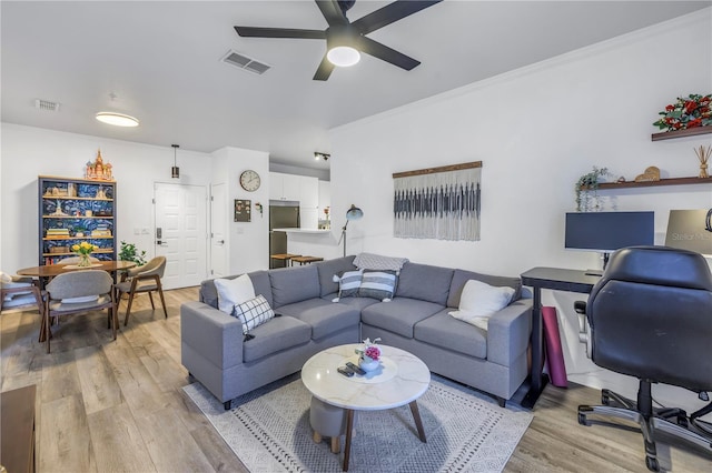 4221 W Spruce St Unit 1325, Tampa, FL 33607 - living room with ceiling fan, crown molding, and light hardwood / wood-style floors